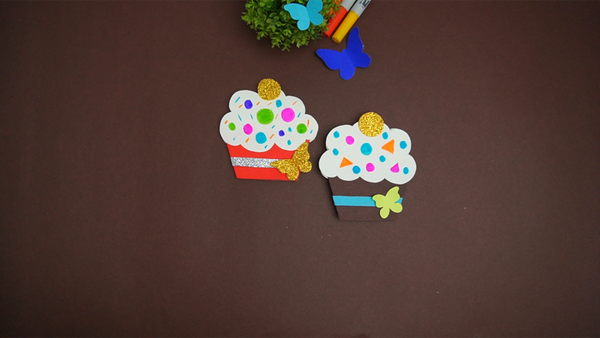 Finished cupcake card craft featuring a handmade cupcake design with colorful frosting, a decorative cherry, and a paper card base.
