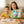 Happy Mum and Child Enjoying Monkey Pen Coloring Books Together